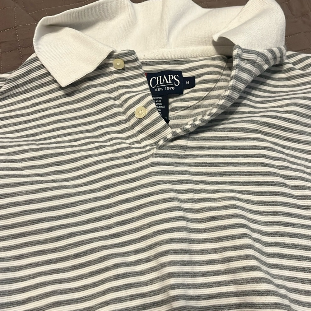 Gently used M long sleeved Chaps polo shirt. No stains or tears.